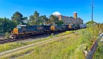 CSX 3295 leads M370 past the one time Firestone Tire & Rubber Co.